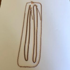 Set of three adjustable bronze necklaces.